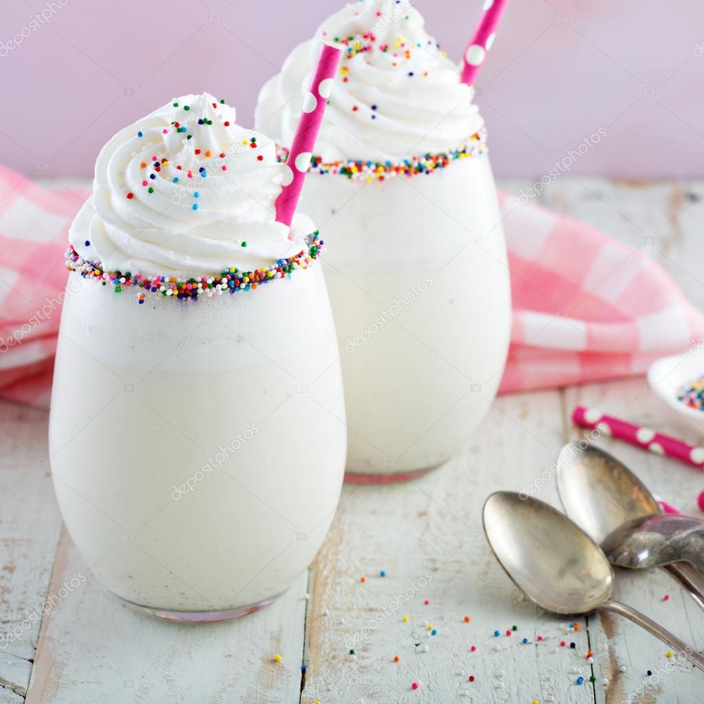 depositphotos 114796904 stock photo vanilla milkshake with whipped cream 1