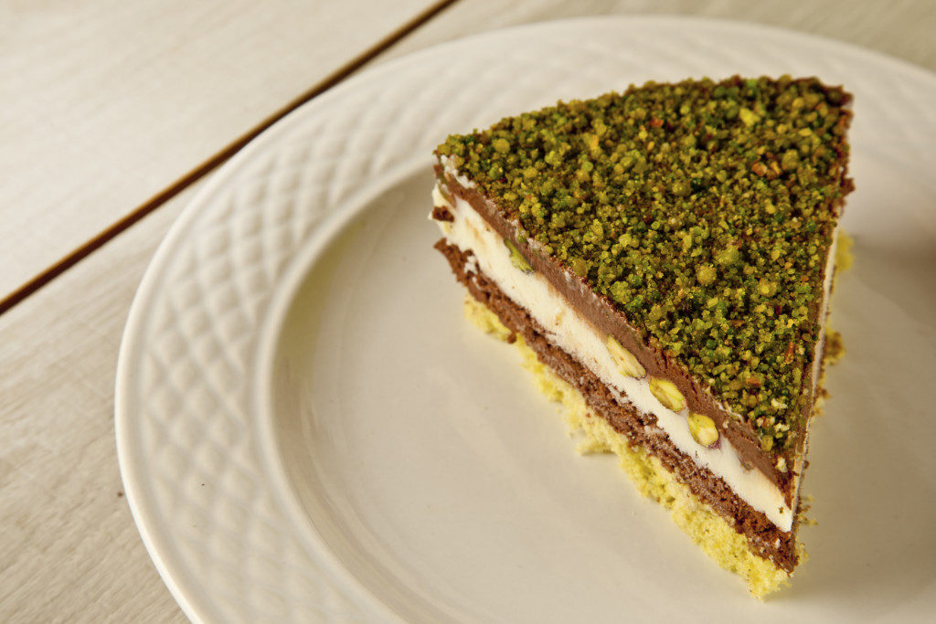 Pistachio cheesecake, decoration on a white plate