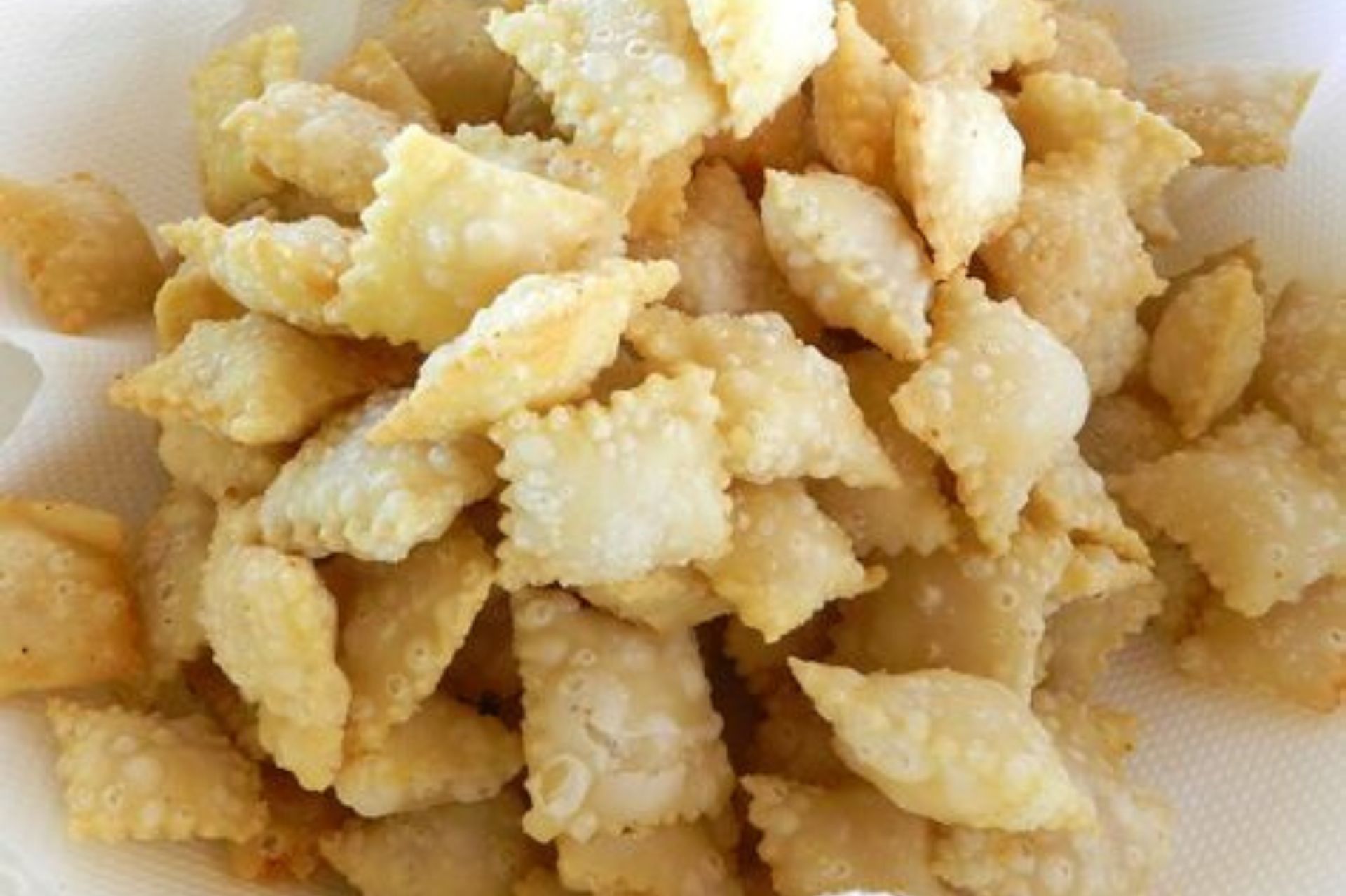 ricetta ravioli di mandorle fritti